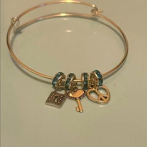 Silver and green love bracelet